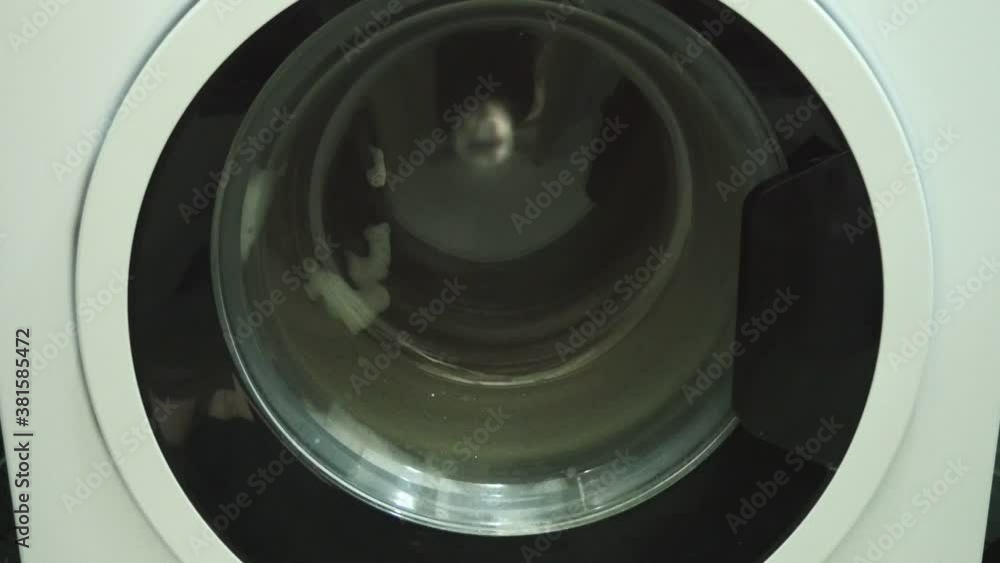 washing machine running in the spin cycle,the washing machine is washing clothes Stock ビデオ