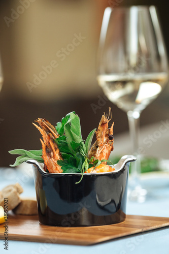 Closeup on spanish dish gambas pil-pil shrimps photo