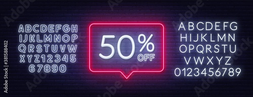 50 percent off discount neon sign. Template for a design. Neon white alphabet on brick wall background.