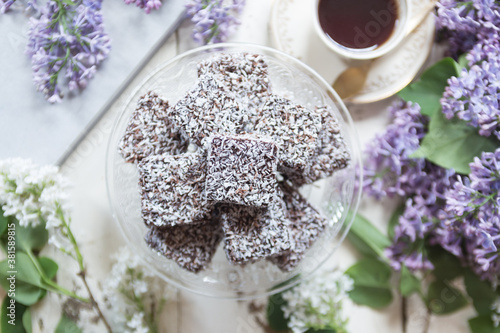 Chocolate & coconut cake with lilac flowers