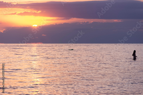 Summertime: beach sunset on the beach in Apulia, Italy.