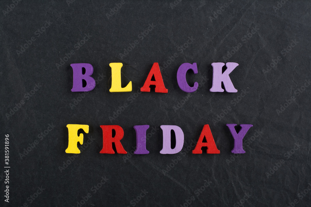 BLACK FRIDAY word on black board background composed from colorful abc alphabet block wooden letters, copy space for ad text. Learning english concept. BLACK FRIDAY word on black board background composed from colorful abc alphabet block wooden letters, copy space for ad text. Learning english concept.