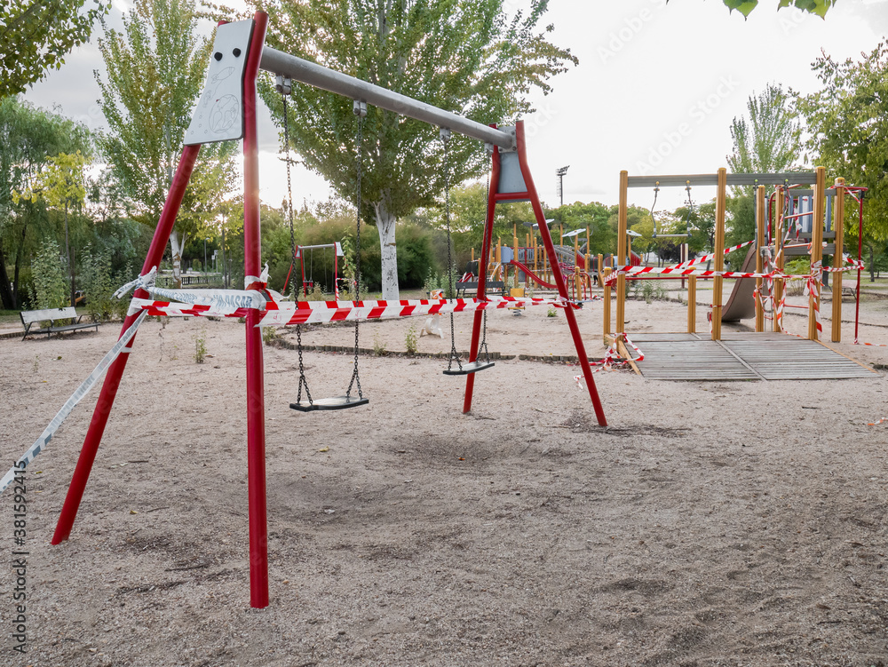 Swings and public parks closed with plastic tapes with the text: Swings and public parks closed with plastic tapes with the text:
