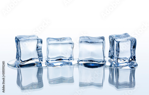Four ice cubes on white background.