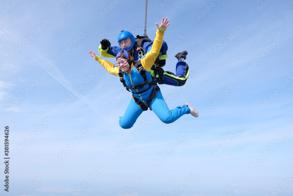 Skydiving. Tandem jump. Man and woman are in the sky. Skydiving. Tandem jump. Man and woman are in the sky.