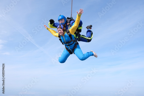 Skydiving. Tandem jump. Man and woman are in the sky. © Sky Antonio