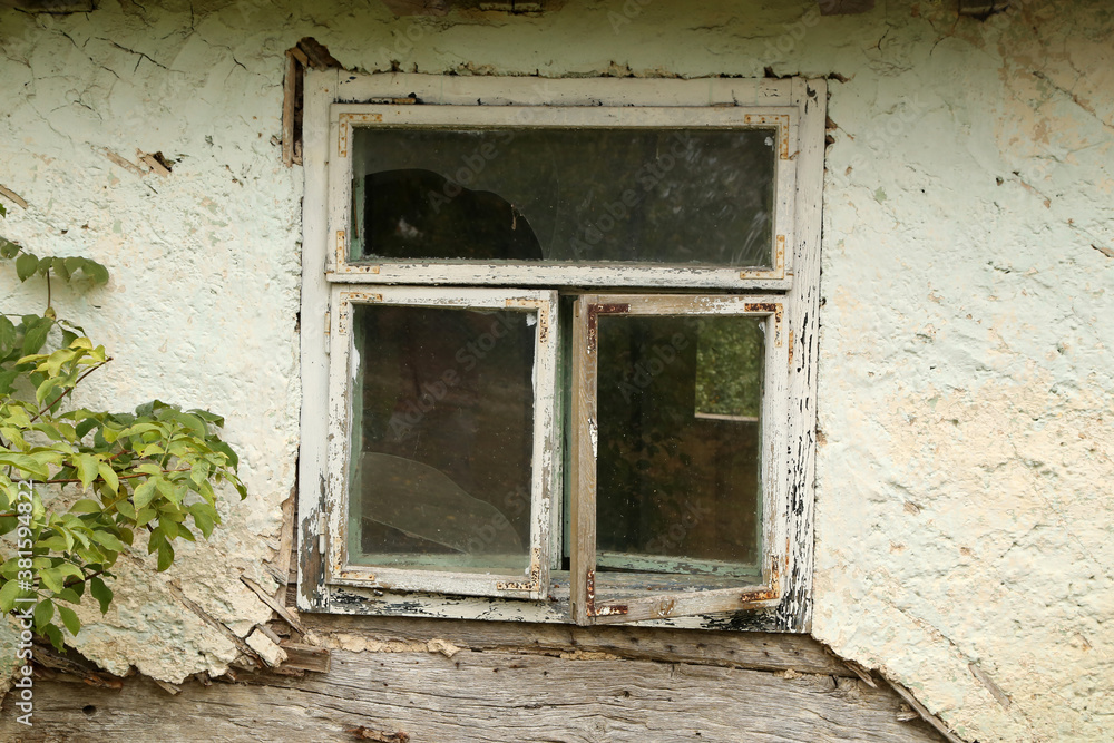 An old window in an old abandoned house
