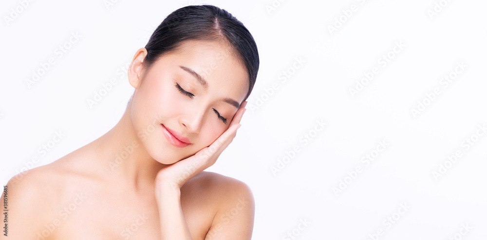 Charming young woman touching her face with clean fresh skin while close eye relax over isolated white background. Beauty cosmetics and healthy concept. Charming young woman touching her face with clean fresh skin while close eye relax over isolated white background. Beauty cosmetics and healthy concept.