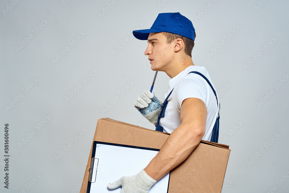 Man worker with box in hands delivery loading service packing service Man worker with box in hands delivery loading service packing service