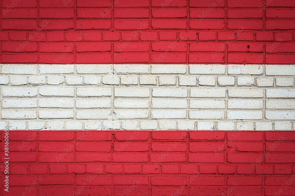 National flag of Austria depicting in paint colors on an old brick wall. Flag banner on brick wall background. National flag of Austria depicting in paint colors on an old brick wall. Flag banner on brick wall background.
