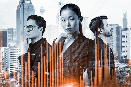 Photography Group of business colleagues in suits as a part of multinational corporate team working on forecasting trading corporate strategy at fund