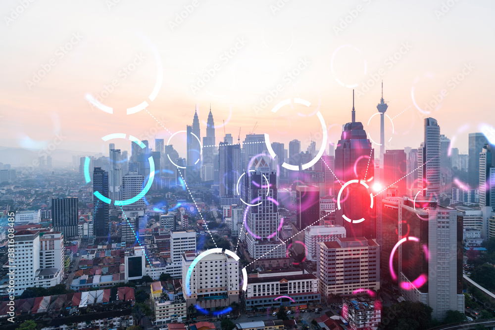 Hologram of abstract technology glowing icons, panoramic cityscape of Kuala Lumpur at sunset, Malaysia, Asia. The concept of worlds technological changes. Double exposure. - obrazy, fototapety, plakaty 