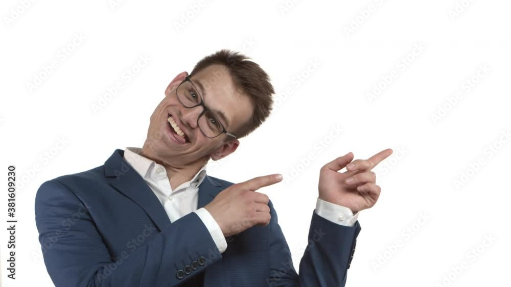 Close-up of cheerful funny businessman with blond hair, wearing glasses and blue suit, pointing fingers at upper right corner and tilting head, recommend to click your link or showing logo Close-up of cheerful funny businessman with blond hair, wearing glasses and blue suit, pointing fingers at upper right corner and tilting head, recommend to click your link or showing logo