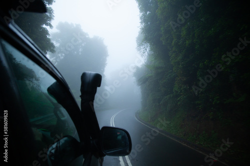 Driving through the fog mountain road