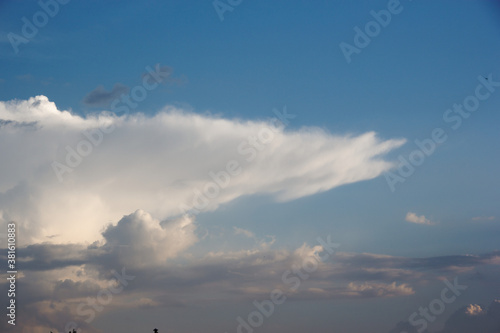 White yacht on sea surface and storm clouds