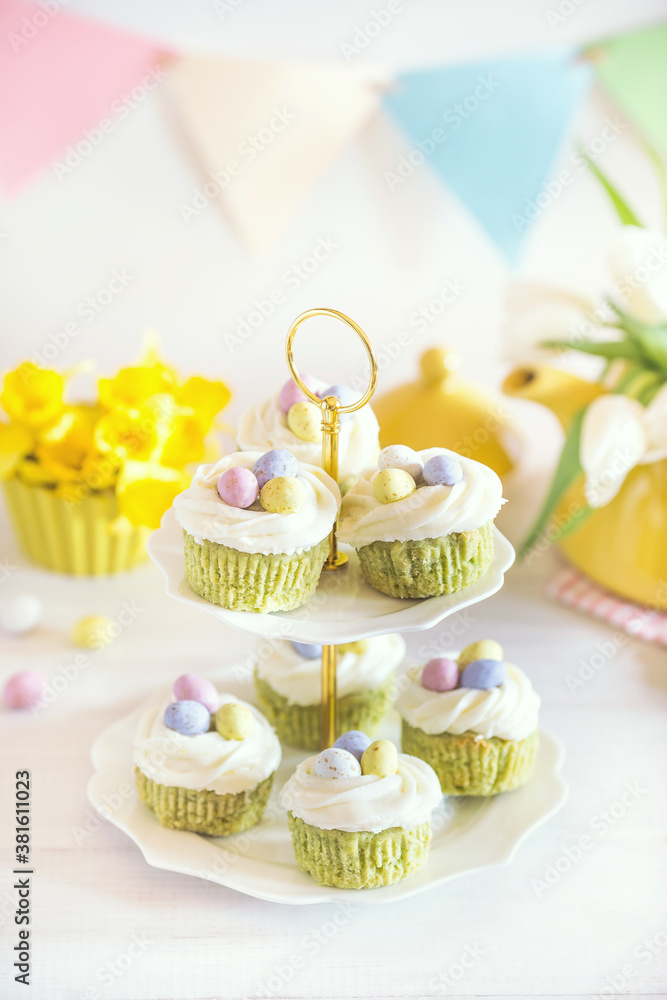 Green Easter cupcakes with colourful eggs