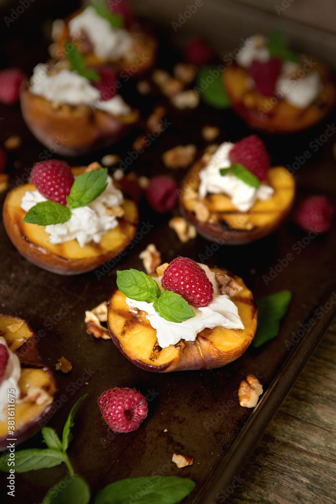 Dark mood grilled summer peaches with cream, raspberries & honey Dark mood grilled summer peaches with cream, raspberries & honey