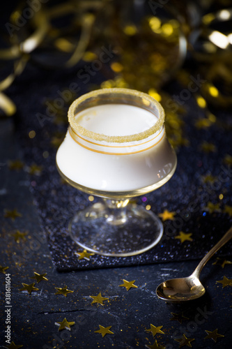 Festive black & gold desserts in glasses photo