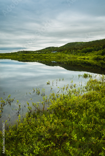 Fototapeta Naklejka Na Ścianę i Meble -  Nature of Karasjok reflected in a river, Norway
