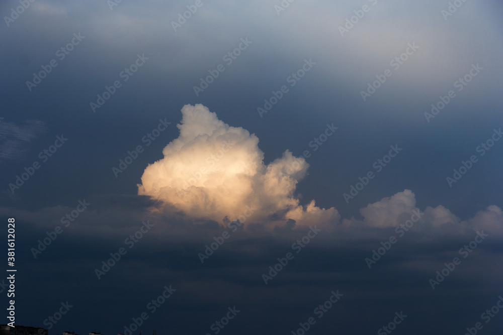 White yacht on sea surface and storm clouds