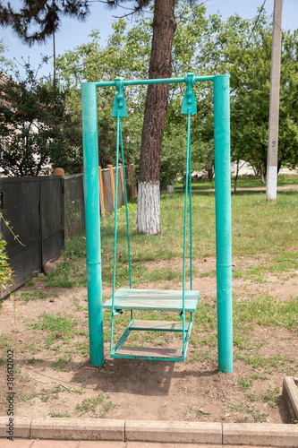 Old rusty swing for children