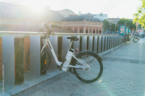 White e-bike parked in the city