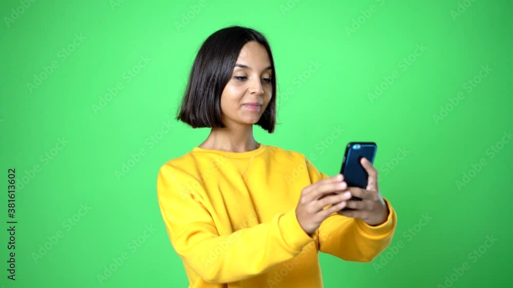 woman posing with arms at hip and laughing woman posing with arms at hip and laughing