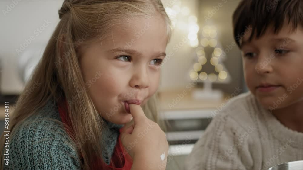 Video of child tasting sugar paste during Christmas baking. Shot with RED helium camera in 8K. Video of child tasting sugar paste during Christmas baking. Shot with RED helium camera in 8K.