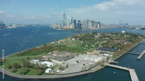 flying over Governor's island towards downtown Manhattan photo
