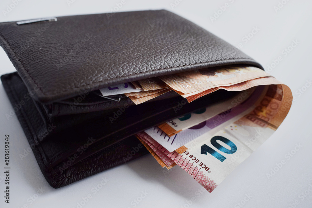 brown leather wallet with euro banknotes isolated on white background brown leather wallet with euro banknotes isolated on white background