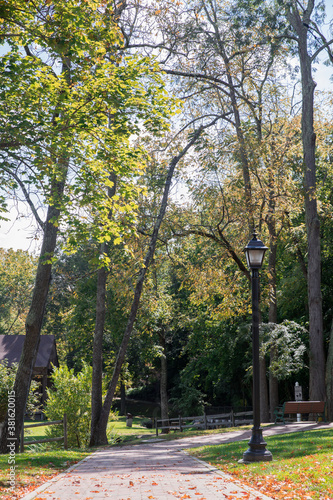 A brick walking path in the Elizabeth Brown Memorial Park in Wytheville, VA USA. Trees line the path.