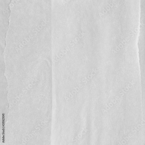 White torn paper collage close-up. Texture made from various paper and cardboard parts. Damaged old paper background. Vintage blank wallpaper. Material design backdrop.