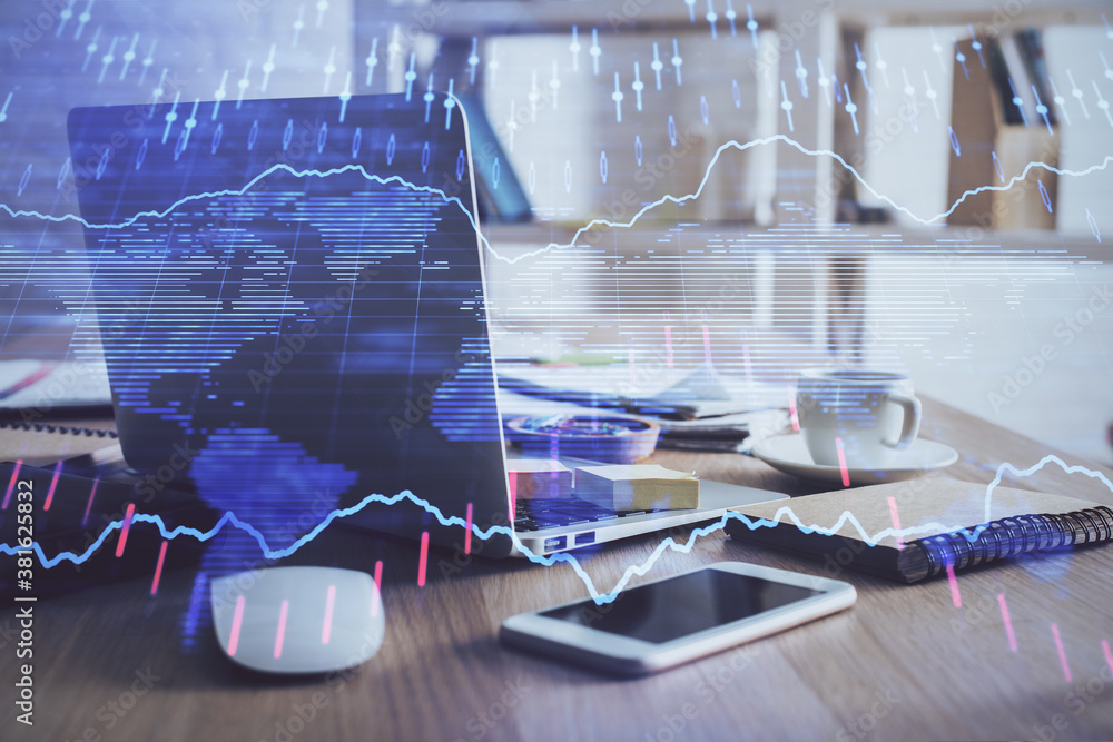 Financial chart drawing and table with computer on background. Double exposure. Concept of international markets. Financial chart drawing and table with computer on background. Double exposure. Concept of international markets.