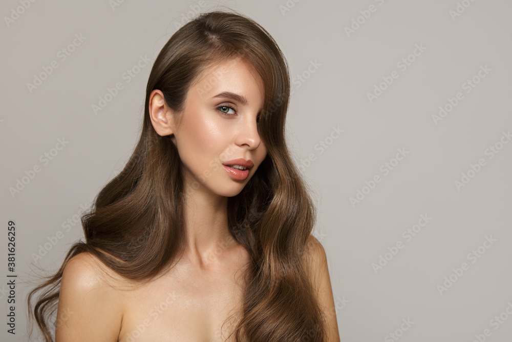 Portrait of a mature woman with luxurious wavy hair. Hair and makeup Portrait of a mature woman with luxurious wavy hair. Hair and makeup
