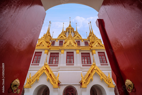 Beautiful sky and Wat Ratchanatdaram Temple in Bangkok, Thailand photo