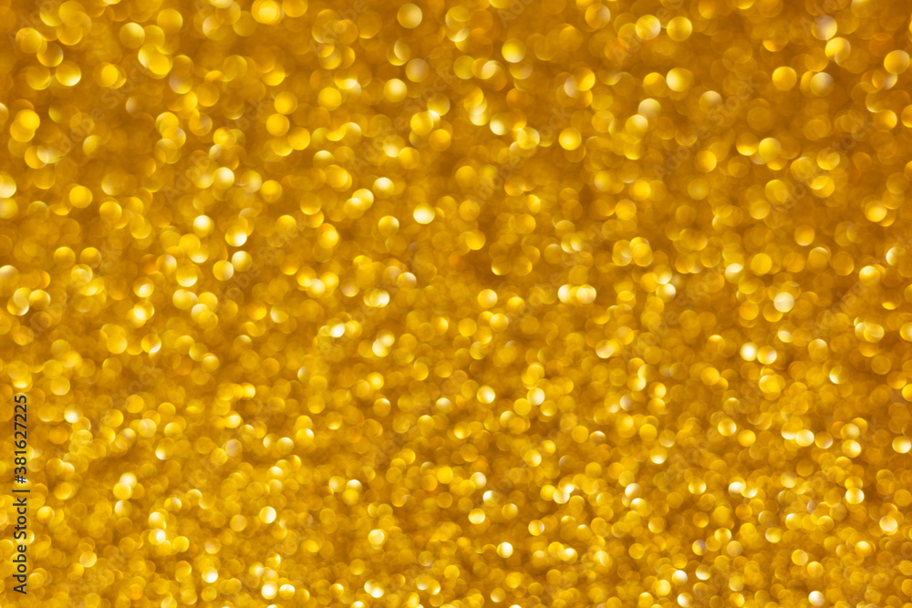 Golden abstract defocused bokeh background. Sparkling texture Golden abstract defocused bokeh background. Sparkling texture