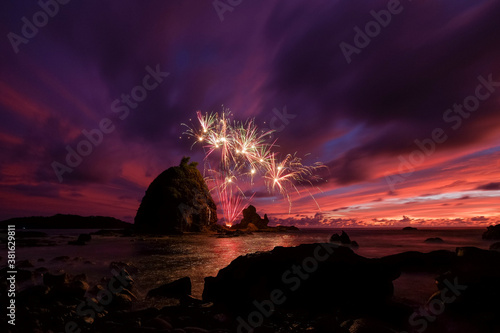 fireworks with sunset sky in the beach