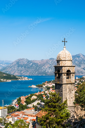 Old church tower and Kotor old town, panoramic view. Kotor bay in Montenegro. Balkans, Adriatic sea, Europe.