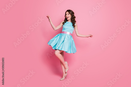 Full length profile photo of wavy charming lady festive event prom party dancing good mood night club chill short skirt wear blue mini dress stilettos isolated pink color background photo