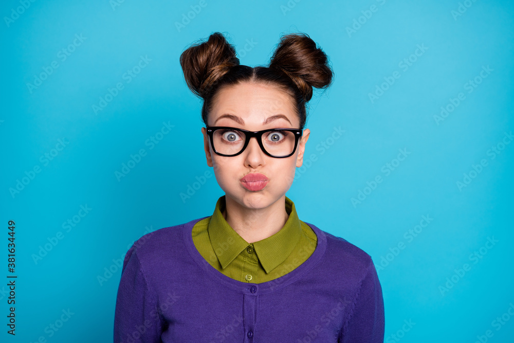 Close-up portrait of her she nice attractive pretty comic childish funky cheery girl holding air in cheeks humour isolated on bright vivid shine vibrant blue green teal turquoise color background