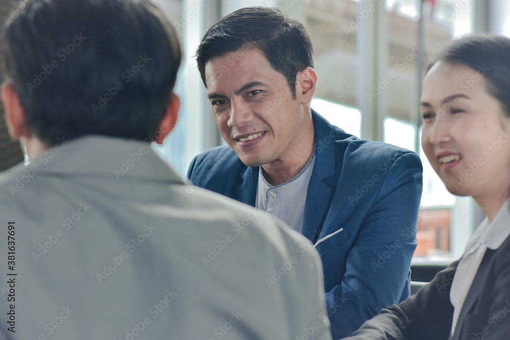Asian man business talking with business team Asian man business talking with business team