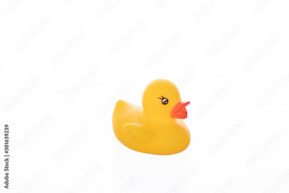 single yellow rubber toy duckling isolated on white background. Minimal style. single yellow rubber toy duckling isolated on white background. Minimal style.