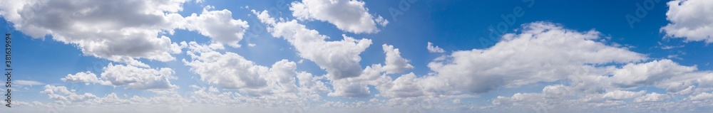 Wide sky panorama with scattered cumulus clouds Wide sky panorama with scattered cumulus clouds