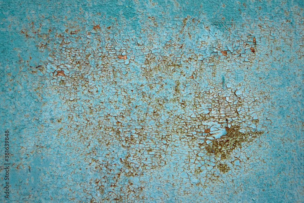 Corroded metal background. Oxidized metal texture with brass and aqua patina, rusty metal surface with streaks of rust.