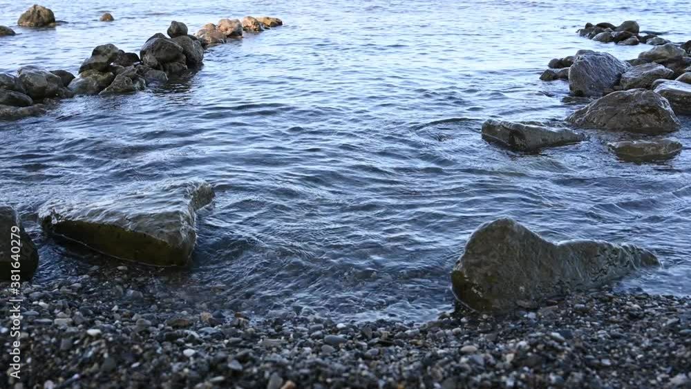sea wave on a stone beach close-up sea wave on a stone beach close-up