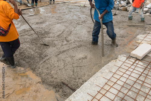 Worker vibrated concrete in construction site