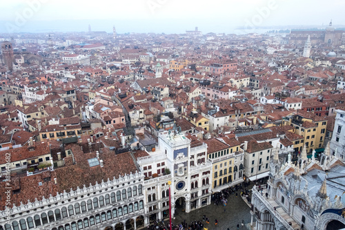 Fototapeta Naklejka Na Ścianę i Meble -  Panorama with the red roofs, Adriatic sea and the most impressive historical buildings of the old romantic Venice, Italy