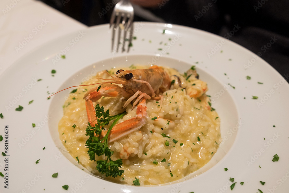 Delicious seafood risotto with prawns as a traditional Italian fish dish in Venice