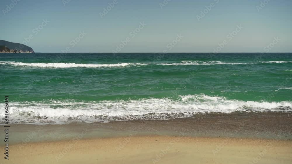 Beautiful seascape with waves and sandy beach. Beautiful seascape with waves and sandy beach.