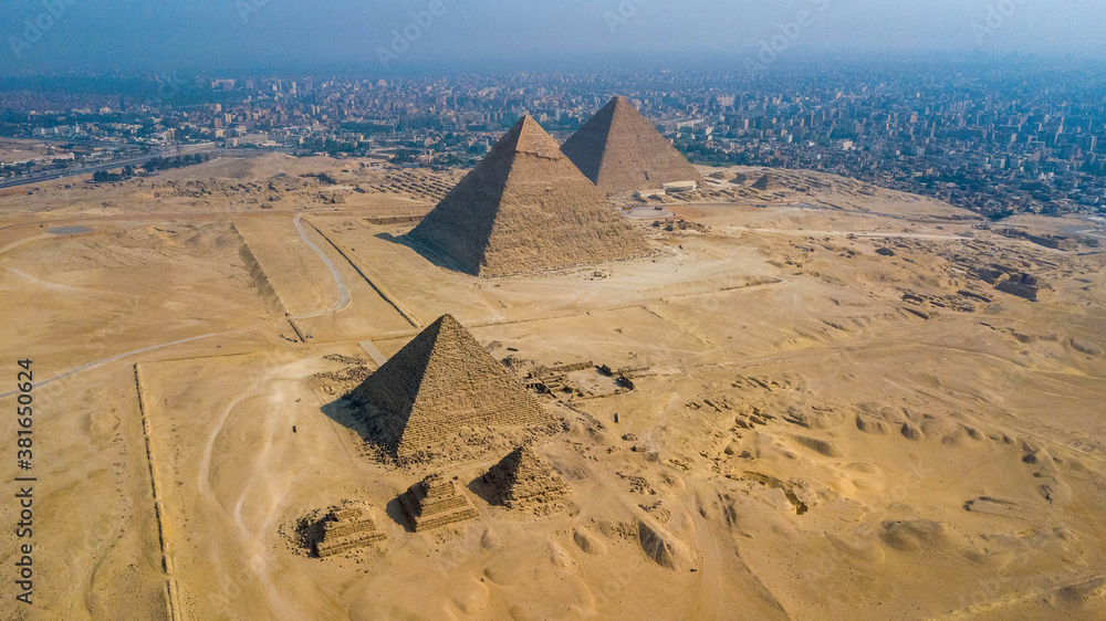 Historical Giza pyramids in Egypt shot by drone. - obrazy, fototapety, plakaty 